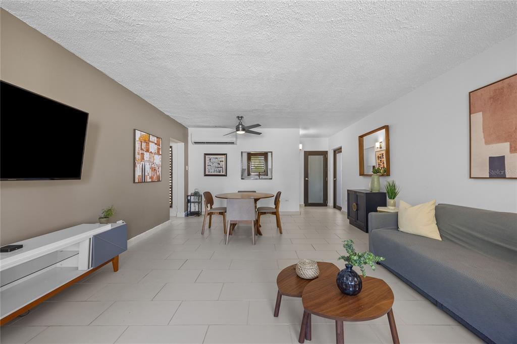 2066 Montesol, Unit 2066 Humacao, PR 00792 - Photo 7 of 29 a living room with furniture and a flat screen tv