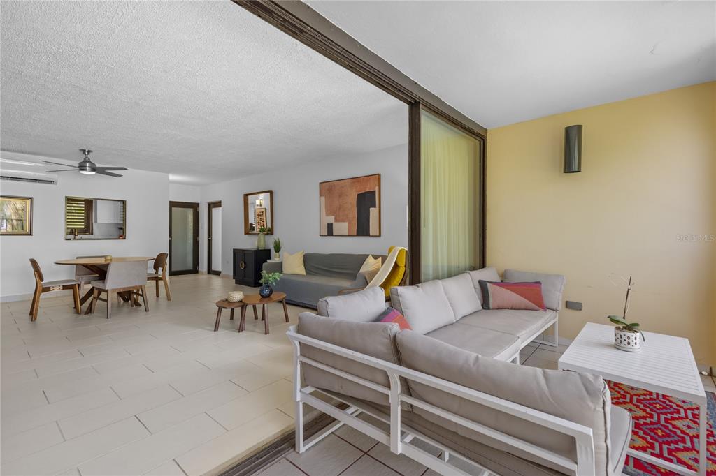 2066 Montesol, Unit 2066 Humacao, PR 00792 - Photo 8 of 29 a living room with furniture and a potted plant