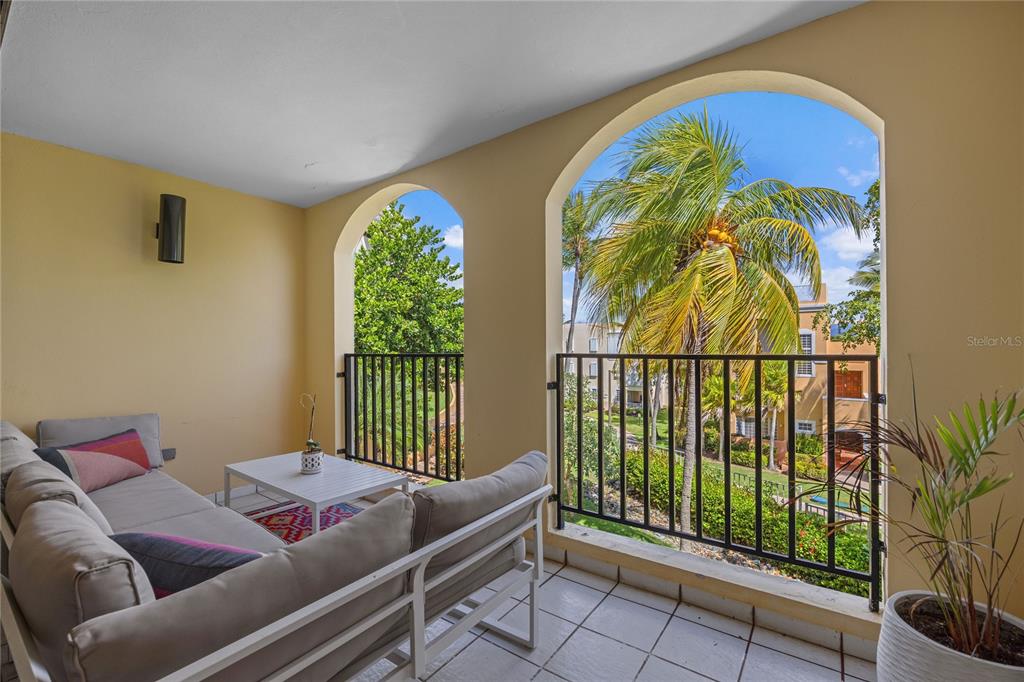 2066 Montesol, Unit 2066 Humacao, PR 00792 - Photo 9 of 29 a living room with furniture and a floor to ceiling window