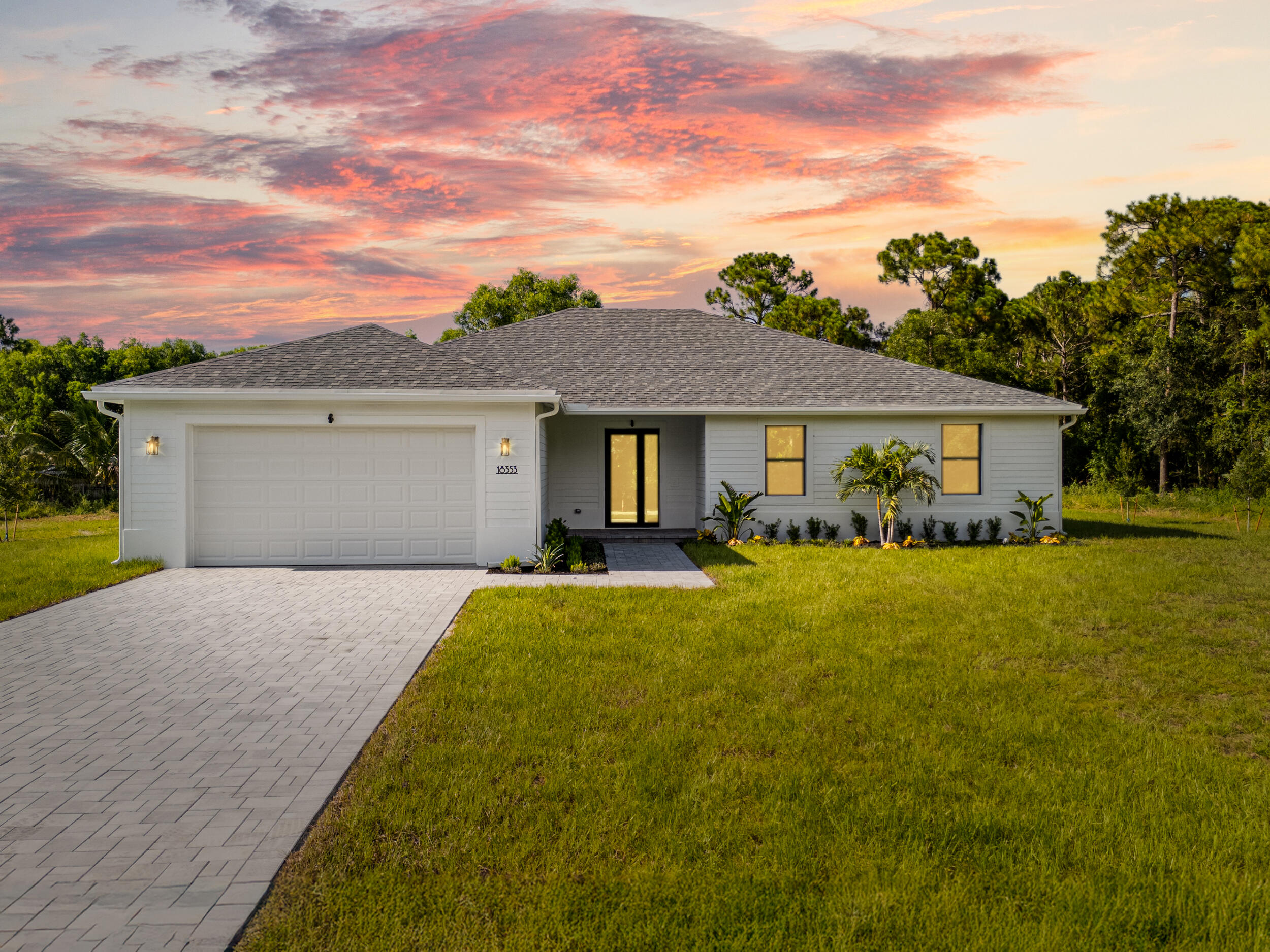1142 Southwest Abbey Avenue Port St. Lucie, FL 34953 - Photo 1 of 57 a front view of house with yard and green space