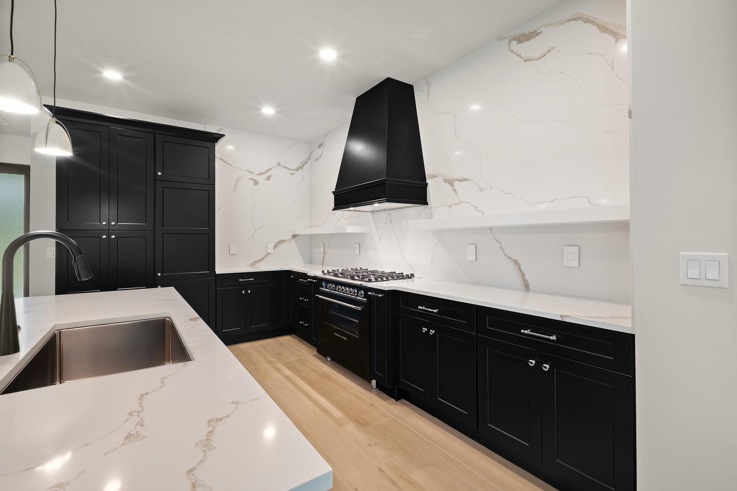 1142 Southwest Abbey Avenue Port St. Lucie, FL 34953 - Photo 17 of 57 a kitchen with a sink and a refrigerator