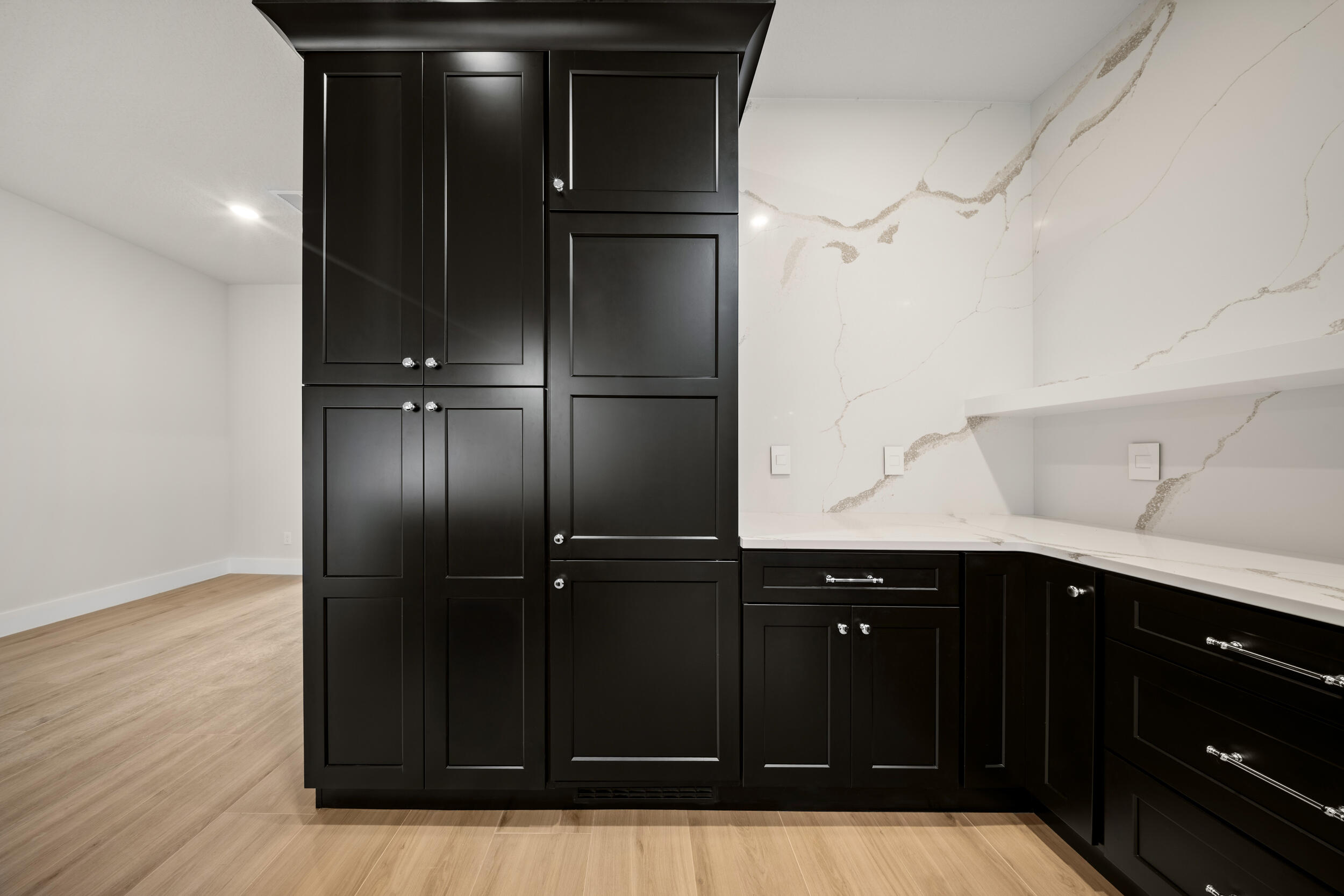 1142 Southwest Abbey Avenue Port St. Lucie, FL 34953 - Photo 20 of 57 a kitchen with a refrigerator and cabinets