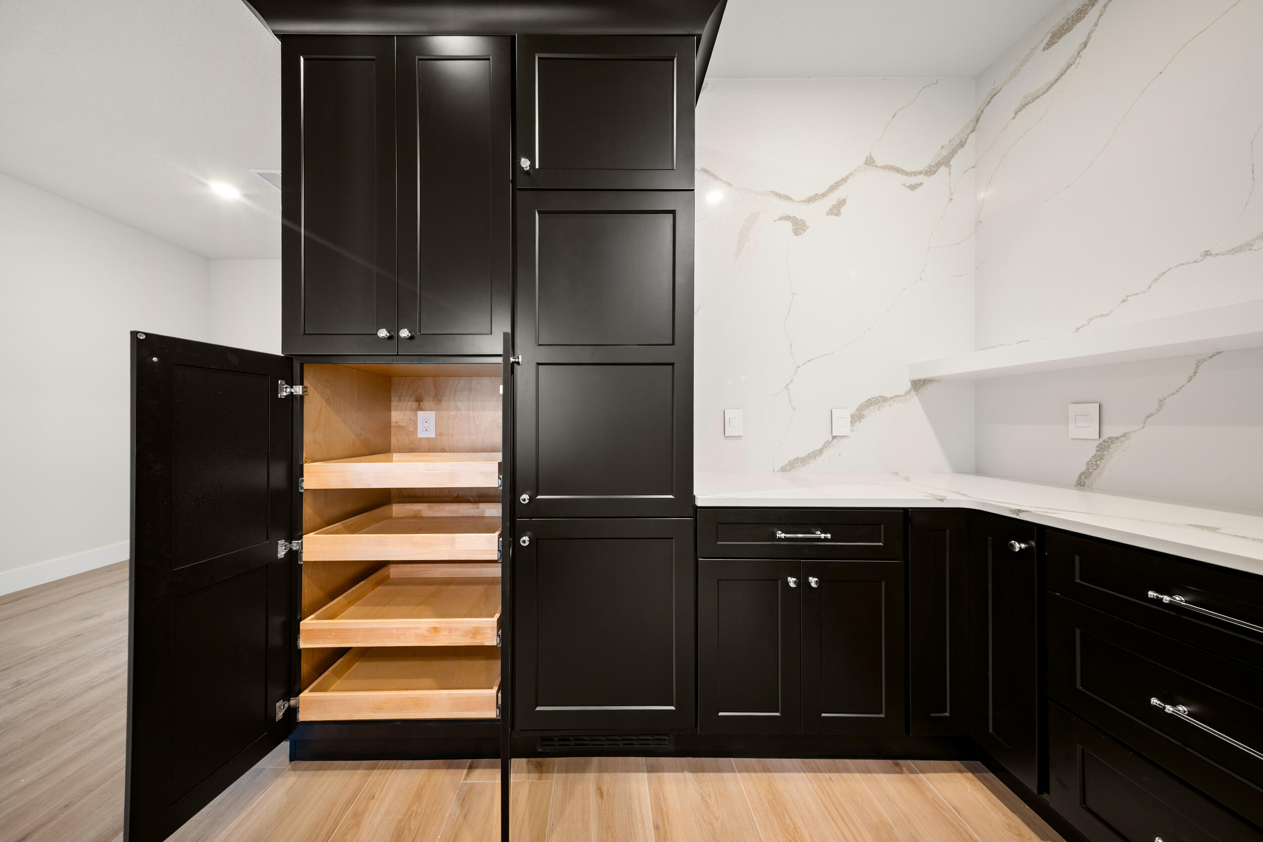 1142 Southwest Abbey Avenue Port St. Lucie, FL 34953 - Photo 22 of 57 a kitchen with a refrigerator and cabinets