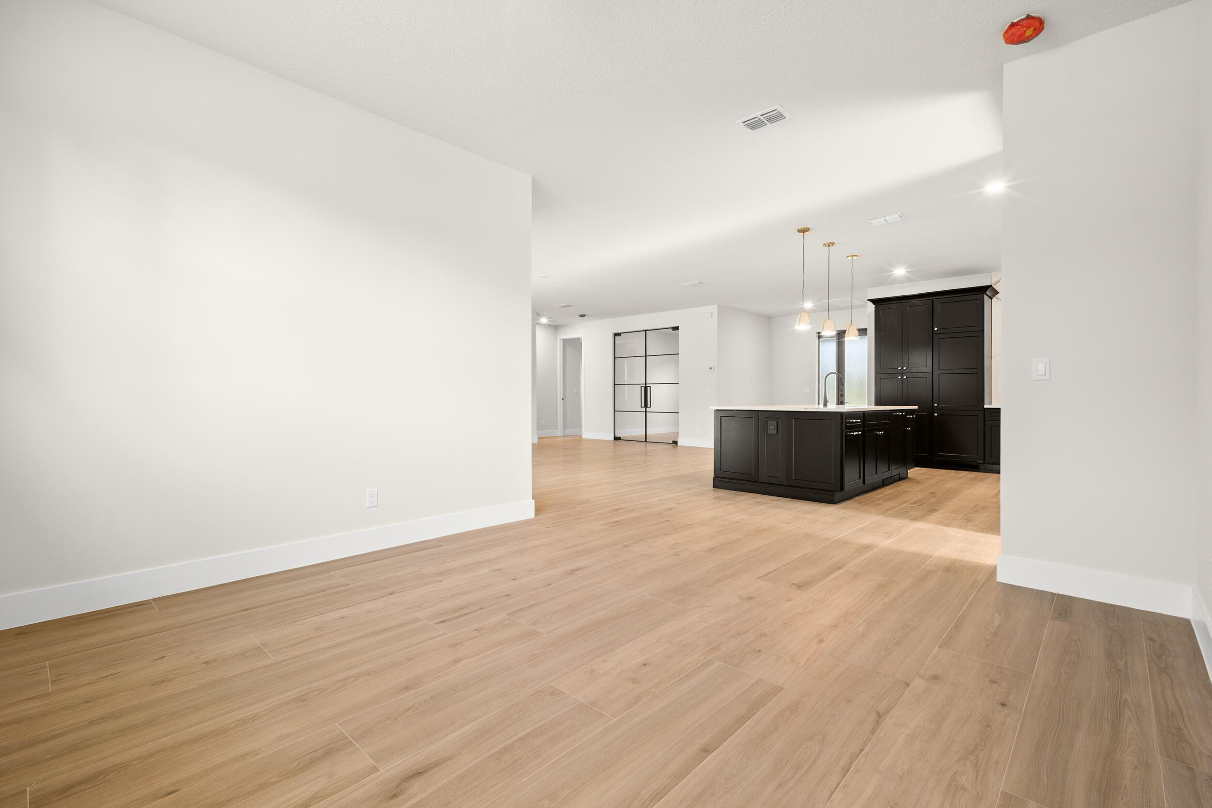 1142 Southwest Abbey Avenue Port St. Lucie, FL 34953 - Photo 29 of 57 a view of a kitchen with a sink and a stove