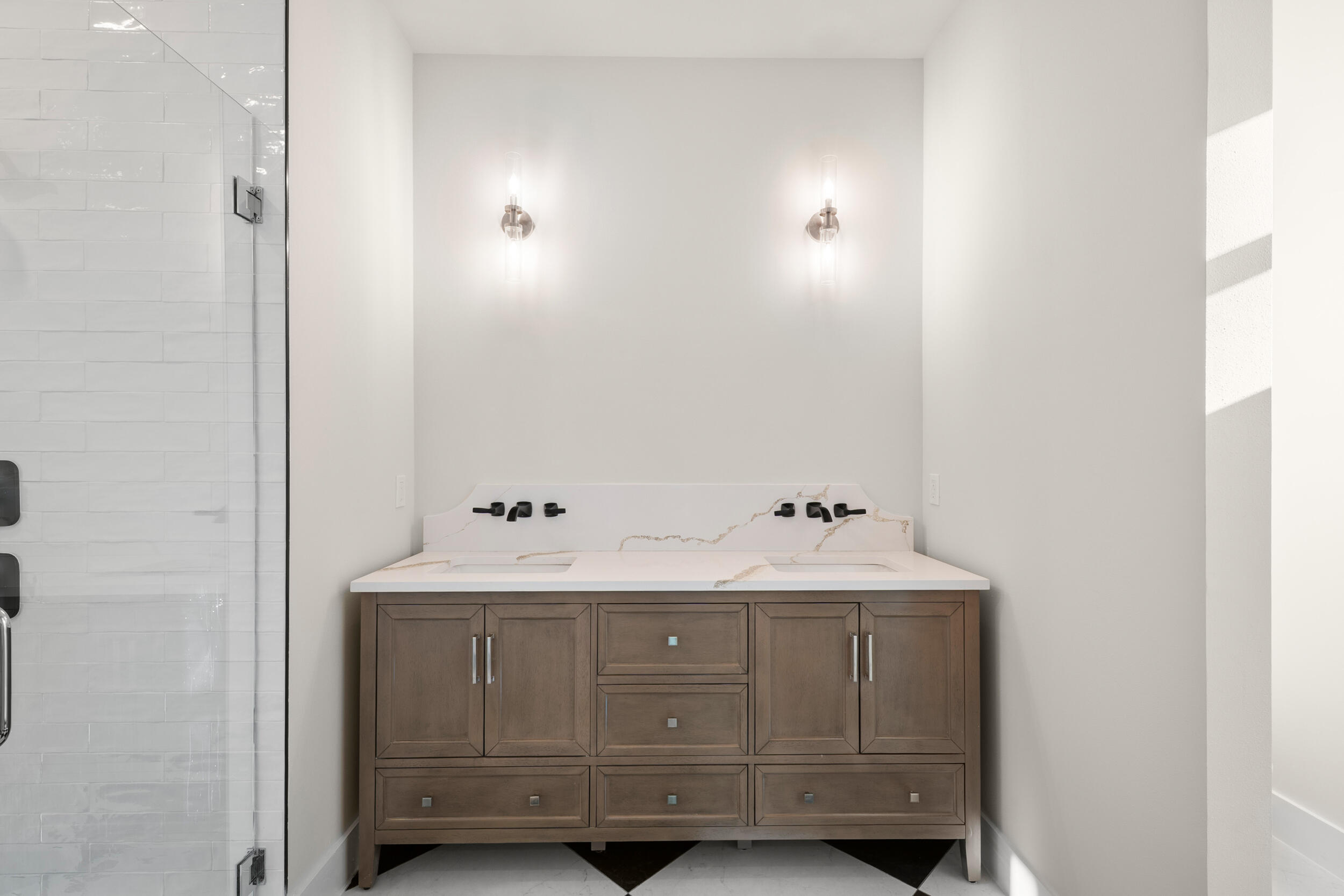 1142 Southwest Abbey Avenue Port St. Lucie, FL 34953 - Photo 46 of 57 a bathroom with a sink and a mirror