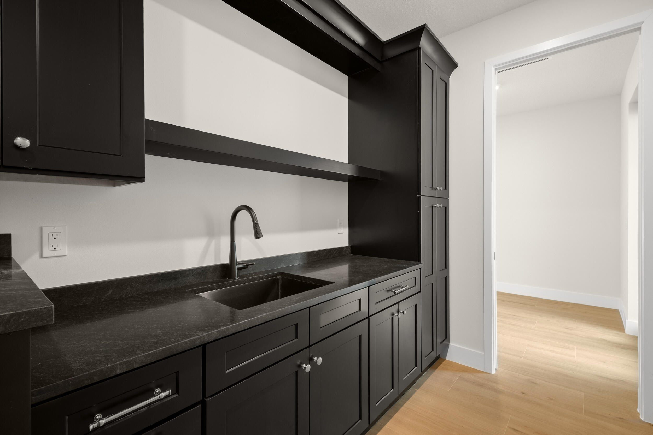 1142 Southwest Abbey Avenue Port St. Lucie, FL 34953 - Photo 9 of 57 a kitchen with a sink and cabinets