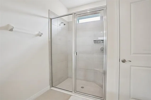 a bathroom with a granite countertop toilet sink and bathtub