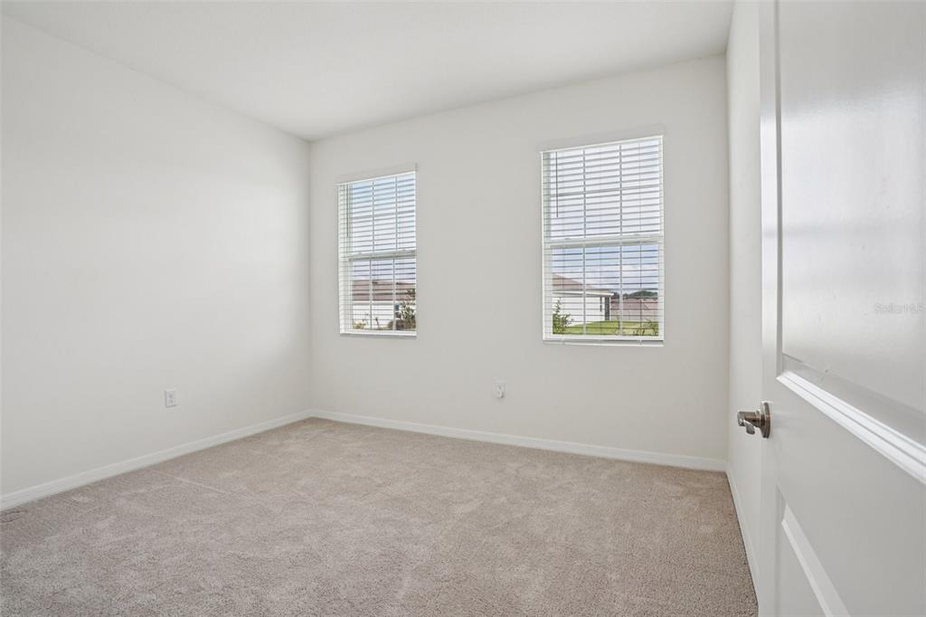 6203 Southwest 93rd Loop Ocala, FL 34476 - Photo 27 of 54 an empty room with windows