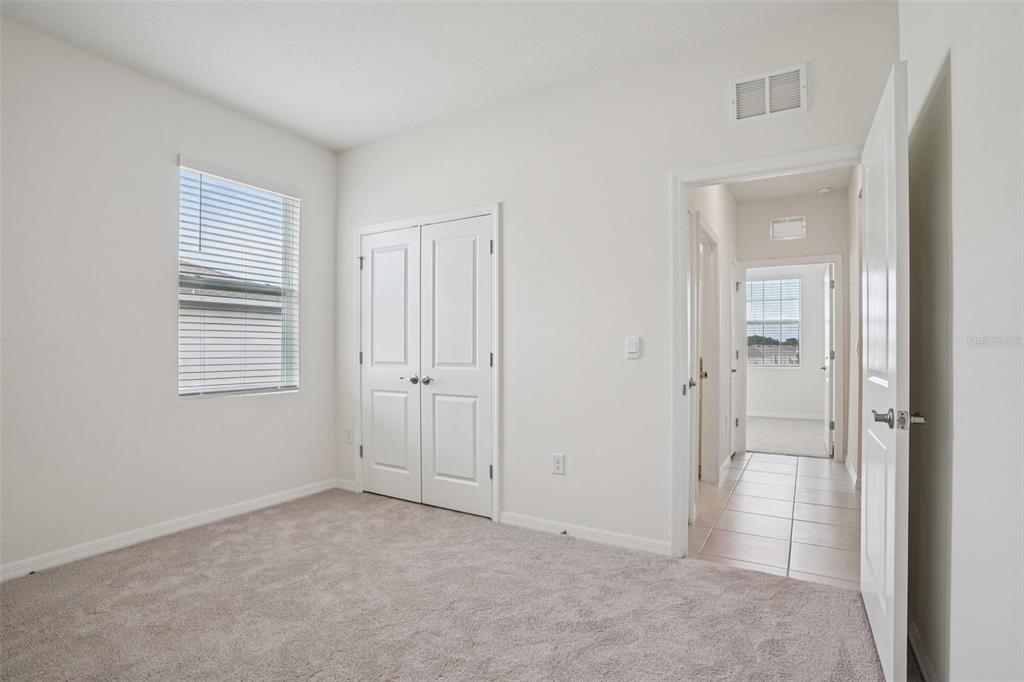 6203 Southwest 93rd Loop Ocala, FL 34476 - Photo 31 of 54 a view of an empty room with closet and a window