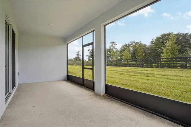 a front view of a house with a garden and yard