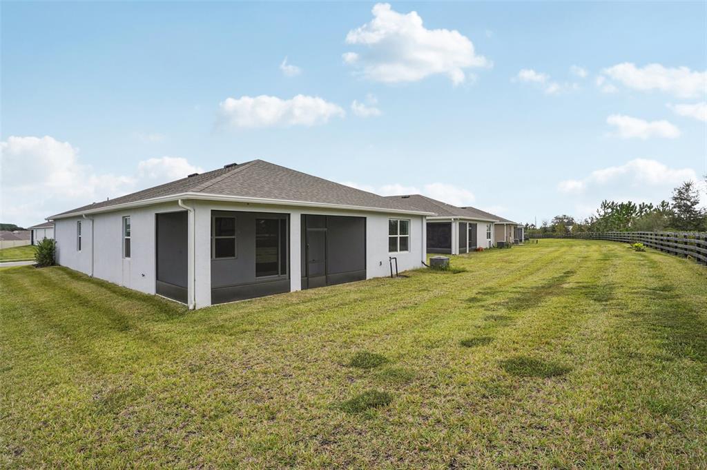 6203 Southwest 93rd Loop Ocala, FL 34476 - Photo 40 of 54 a view of a yard in front of a house with a large tree