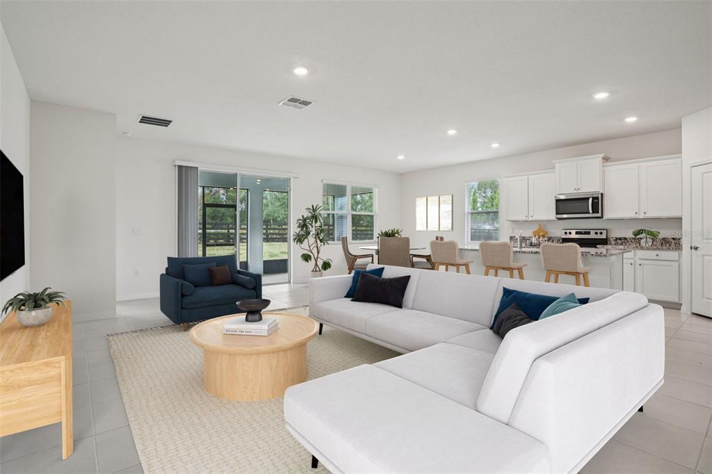 6203 Southwest 93rd Loop Ocala, FL 34476 - Photo 4 of 54 a living room with furniture and a large window