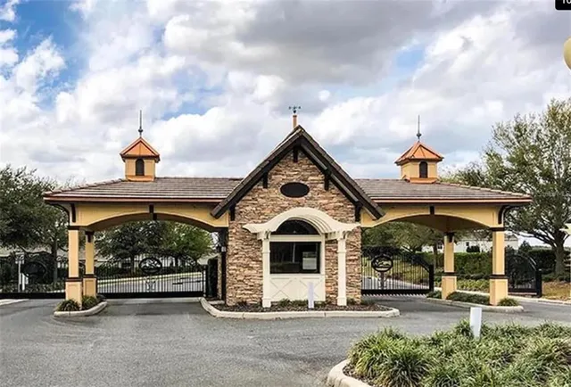 a view of a palm plant that is in front of a building