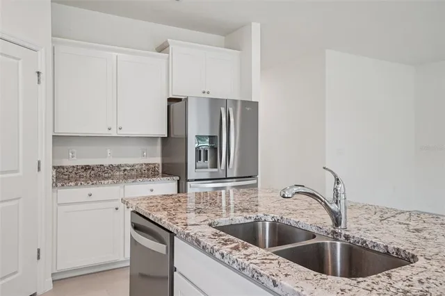 a view of a kitchen with microwave and cabinets