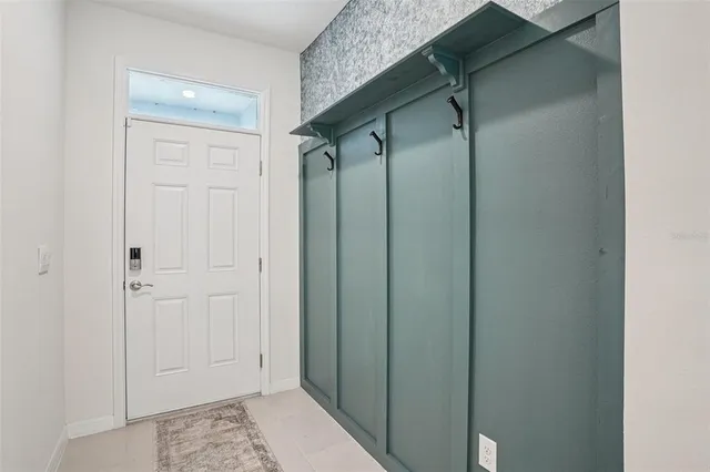 a kitchen with stainless steel appliances a refrigerator sink and cabinets