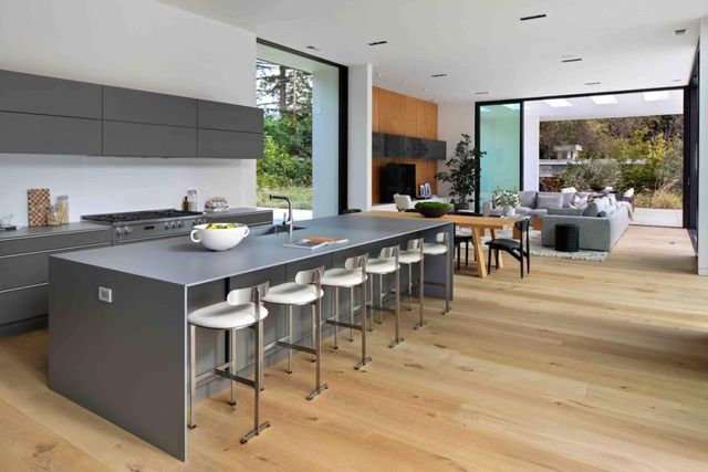 a view of a dining room with furniture and window