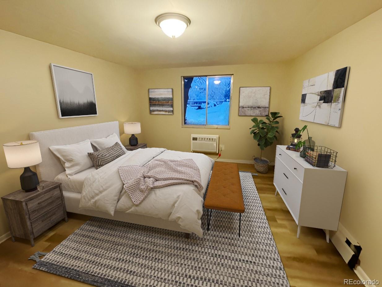 1304 South Parker Road, Unit 148 Denver, CO 80231 - Photo 11 of 23 a spacious bedroom with a bed and a couch