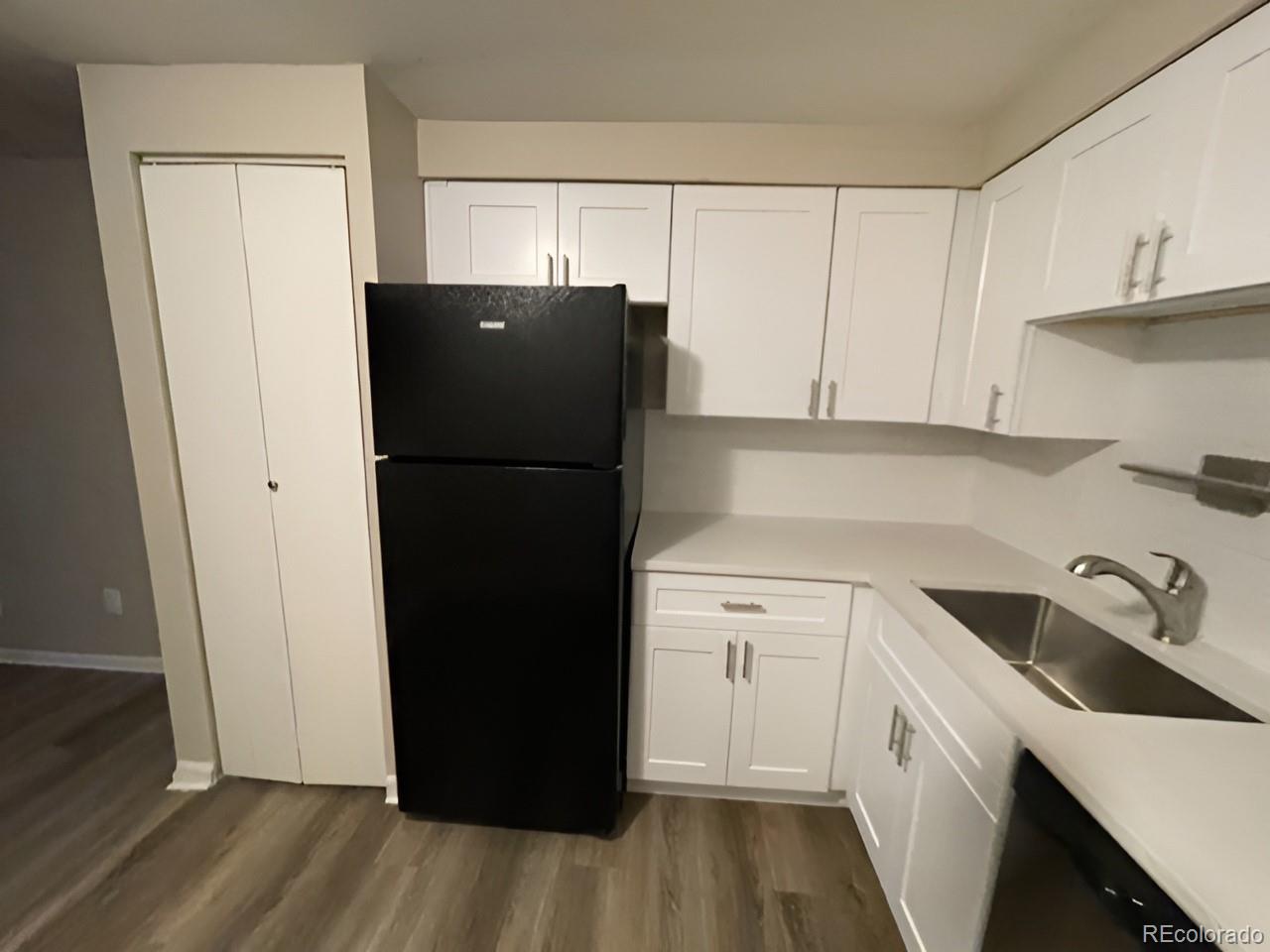 1304 South Parker Road, Unit 148 Denver, CO 80231 - Photo 19 of 23 a white refrigerator freezer sitting inside of a kitchen