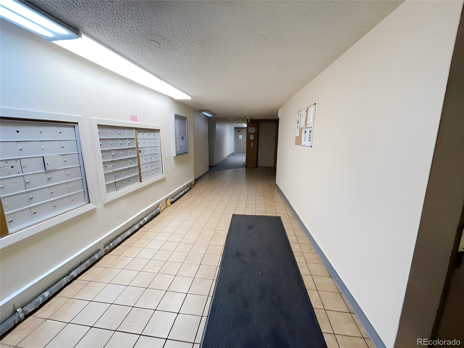 1304 South Parker Road, Unit 148 Denver, CO 80231 - Photo 22 of 23 a view of hallway with stairs