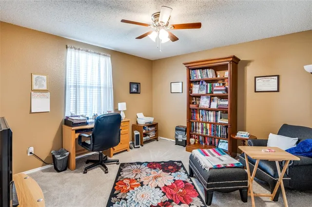 a living room with furniture workspace and a window