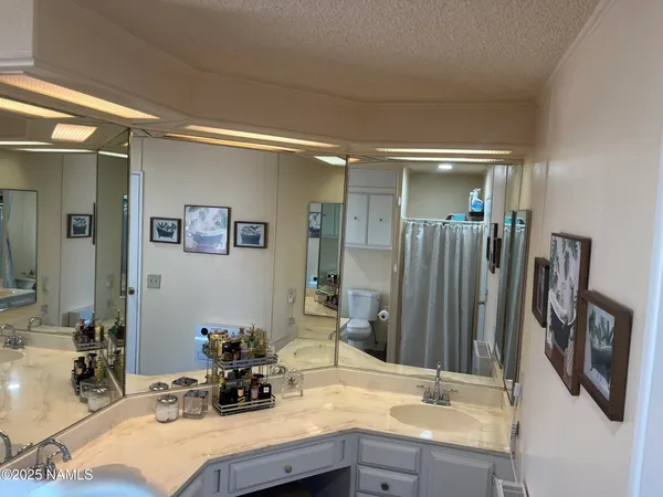 a bathroom with a double vanity sink a and mirror