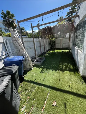 a view of a backyard with sitting area