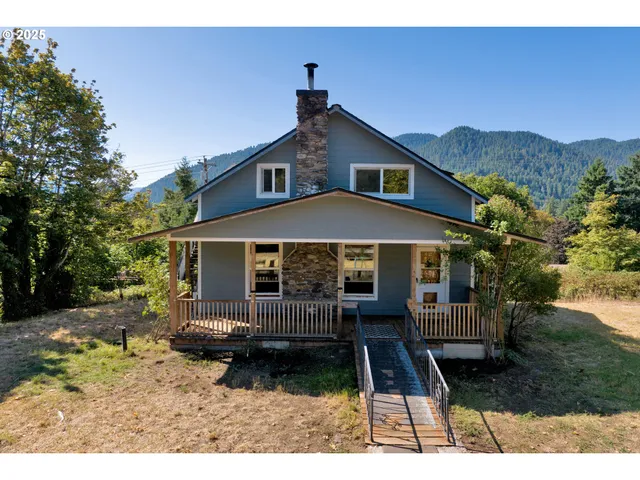 a front view of house with a garden