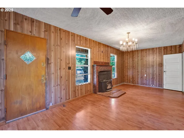 a view of a livingroom with furniture and chandelier