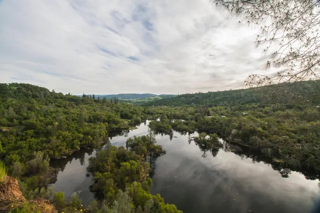 a view of lake with green space