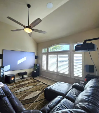 a bedroom with a bed window and couch