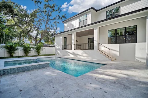 a kitchen that has a sink and a stove in it