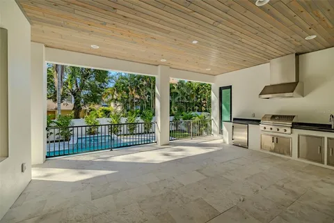 a bathroom with a double vanity sink a large mirror and a shower