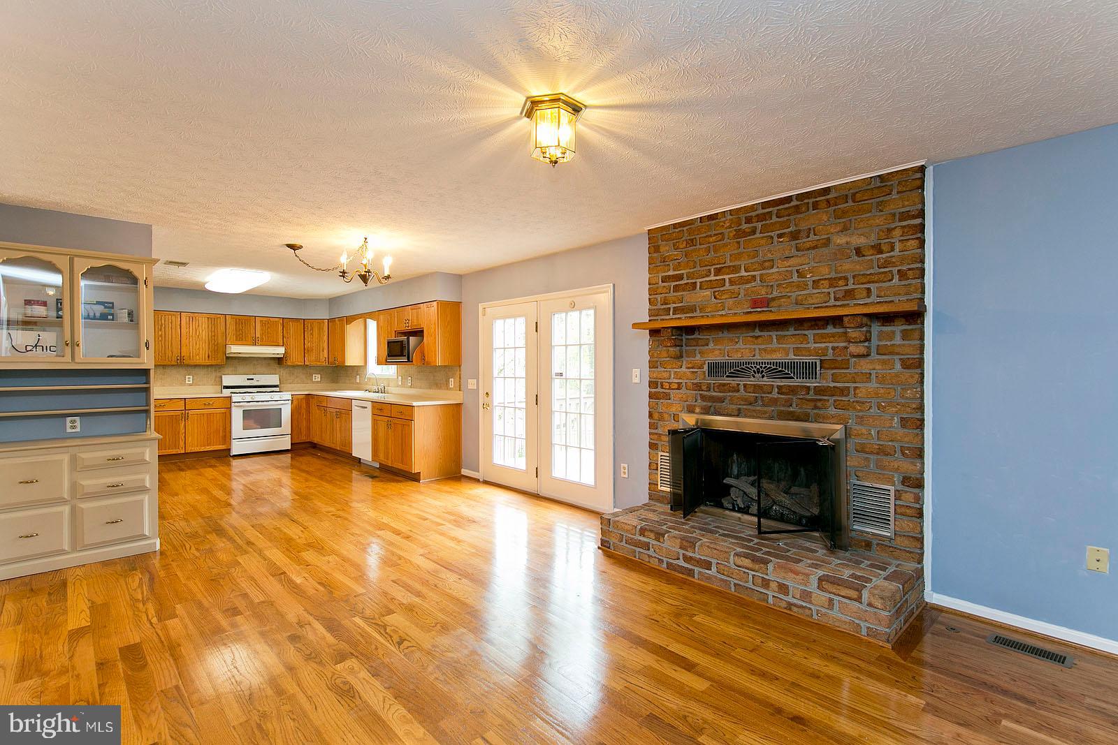 106 Forest Ridge Road Winchester, VA 22602 - Photo 12 of 37 Family room off of kitchen w/ gorgeous fireplace