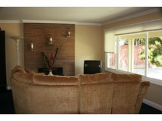 1203 Hazel Avenue Campbell, CA 95008 - Photo 3 of 9 a bedroom with a bed and a potted plant