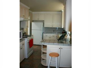 1203 Hazel Avenue Campbell, CA 95008 - Photo 5 of 9 a kitchen with a refrigerator and cabinets