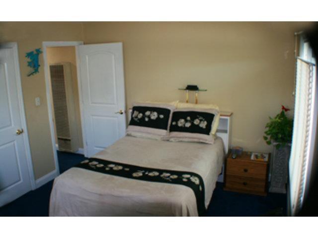 1203 Hazel Avenue Campbell, CA 95008 - Photo 7 of 9 a bedroom with a bed and a window