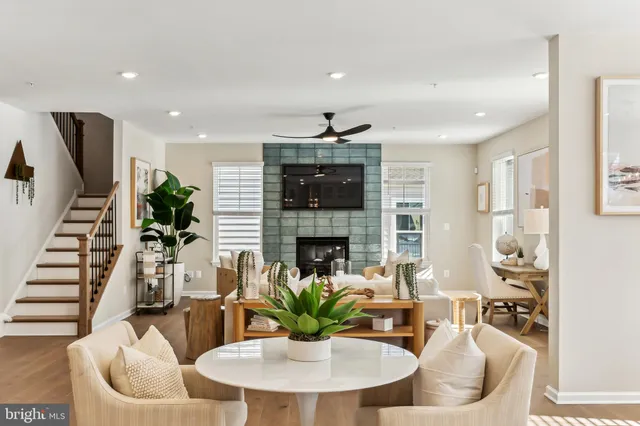 a spacious bedroom with a bed a couch and dresser