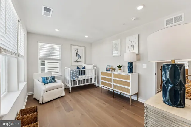 a bathroom with a granite countertop toilet a sink and a bathtub
