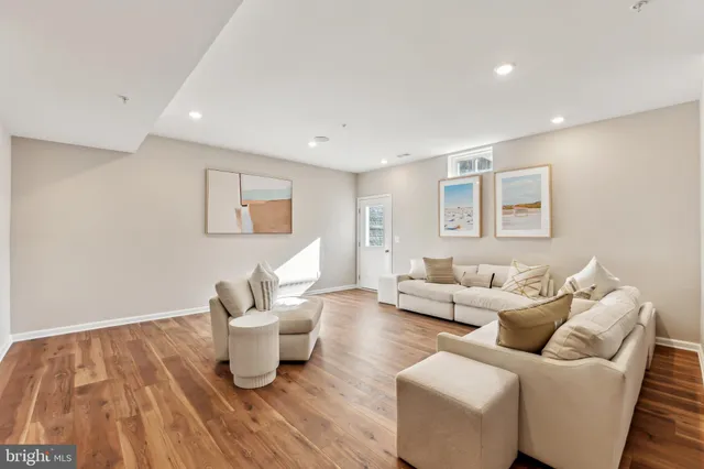 a view of a room with wooden floor