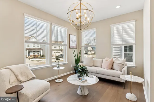 a living room with furniture fireplace and view of kitchen