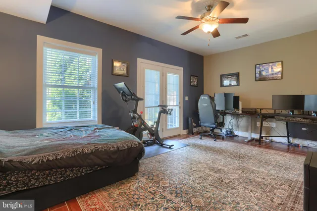 a bedroom with a bed and a table in it