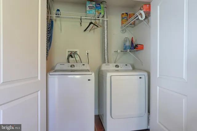 a view of a roof deck with furniture