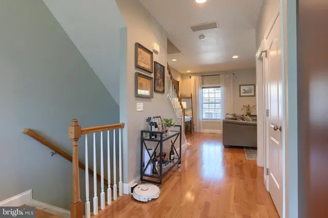 a view of an entryway with wooden floor and windows
