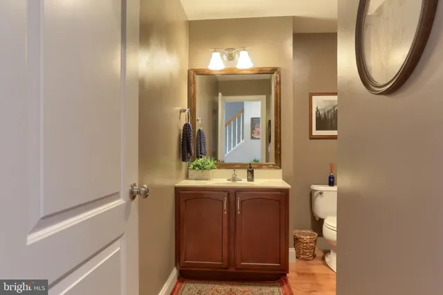 a bathroom with a mirror and a sink