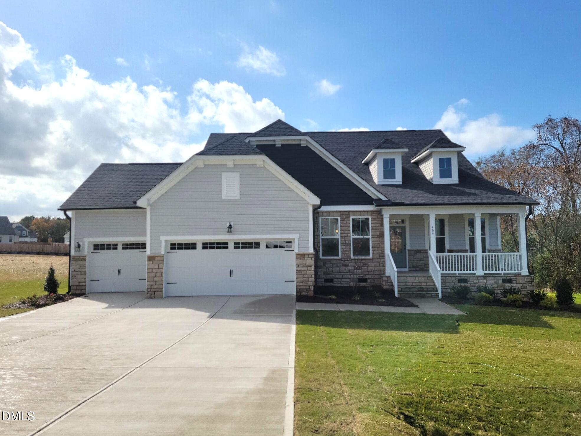 409 Grading Stick Court Angier, NC 27501 - Photo 1 of 52 a front view of a house with a yard