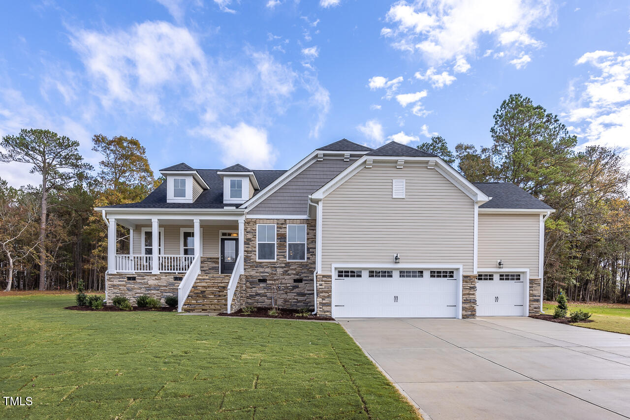 409 Grading Stick Court Angier, NC 27501 - Photo 2 of 52 a view of a house with a yard and potted plants