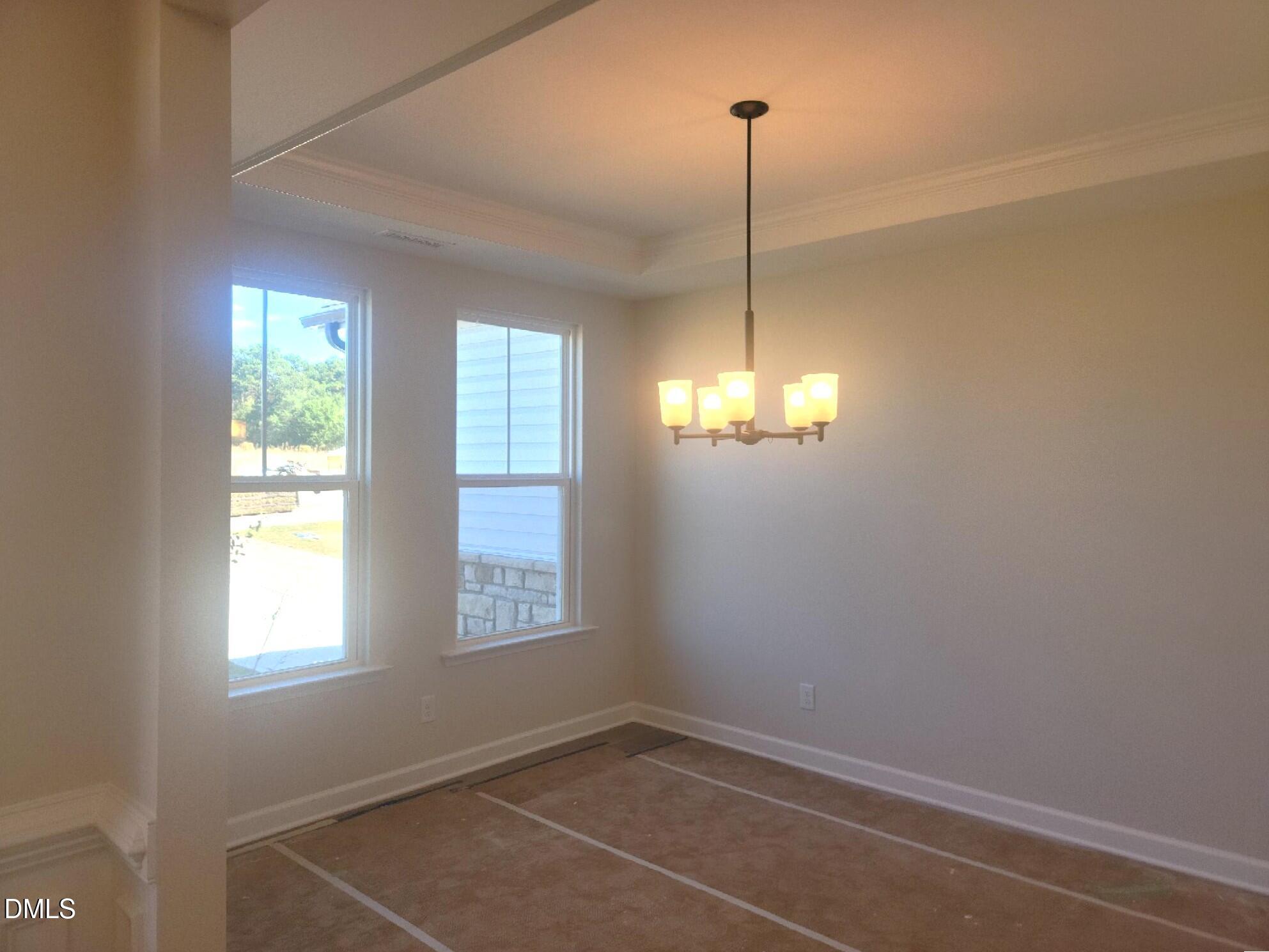 409 Grading Stick Court Angier, NC 27501 - Photo 44 of 52 a view of a room with windows and chandelier