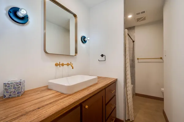a bathroom with a sink and a mirror