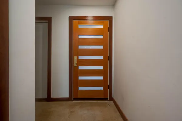 a view of an empty room with a hallway