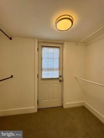 a view of balcony with wooden floor